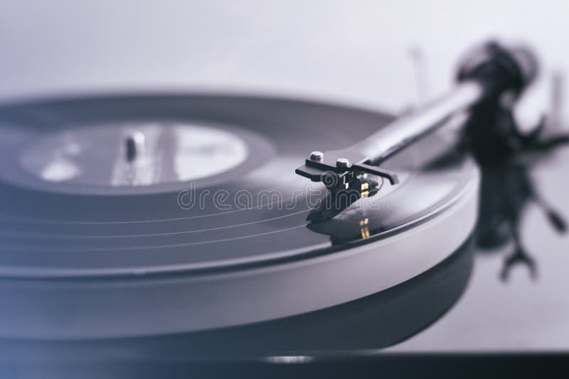 Detail of a modern vinyl record player (turntable) with a vintage image look. Detail of a modern vinyl record player (turntable) with a vintage image look.